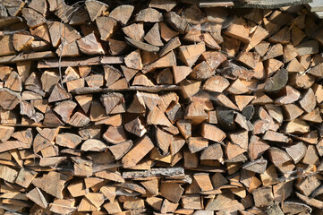 Firewood harvested for heating in winter. Firewood background