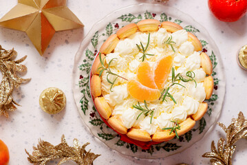 Mandarin Charlotte cake on a Christmas rustic background