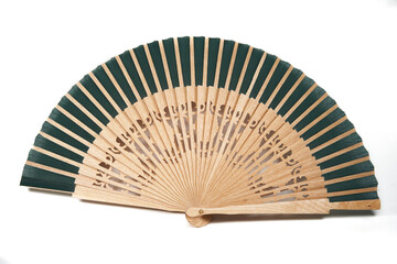 Isolated spanish style timber and cloth green fan for hot summer days over white background