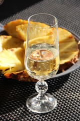Bridal Shower. A glass of champagne with pineapple pieces
