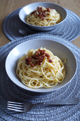 Plates with Italian specialty spaghetti carbonara