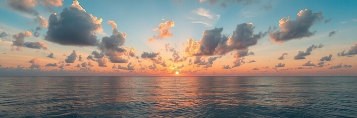 Obraz premium Vibrant sunrise with colorful sky reflecting in calm ocean waters, serene, sun