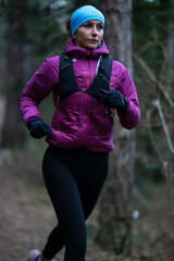Fototapeta premium trail running woman athlete training for ultra-marathon race in a mountain
