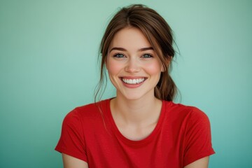Fototapeta premium A woman with a bright smile wearing a red shirt, suitable for portraits or everyday life scenes
