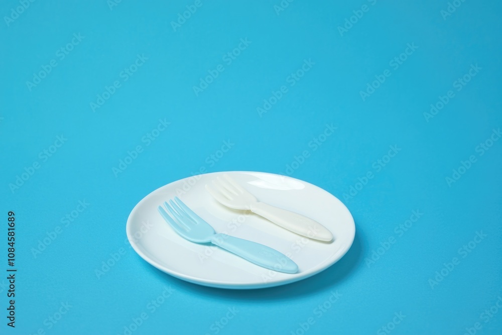 Poster a table setting with a plate featuring two forks and a knife