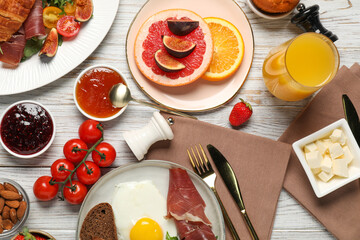 Different tasty food served for brunch on white wooden table, flat lay