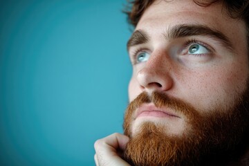 Obraz premium A close-up shot of a bearded man's face, suitable for use in portraits or editorial features