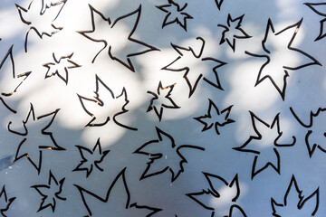 Carved in the shape of maple leaves on an iron panel.