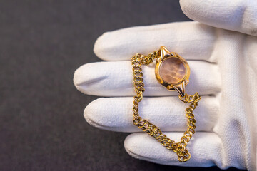 A gold case from a mechanical watch.Buying gold from the population.Pawnshop.Sale of jewelry.