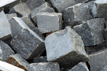 Gray street stones stacked in a pile