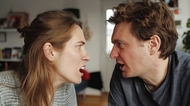 Man and woman in intense argument, facing each other with expressions of anger and frustration. Concept of relationship conflict, communication issues, emotional tension, interpersonal disagreement