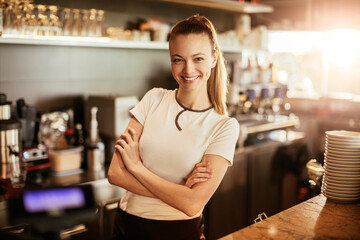 Portrait of a young female barista working at a cafe