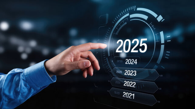 A hand is pointing to the year 2025 on a screen. Concept of progress and advancement, as the year is projected into the future. The blue shirt worn by the person in the image adds a touch of color