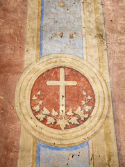 view to cross on old fresco in catholic church