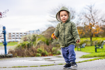 Toddler Enjoying a Stroll in a Scenic Park