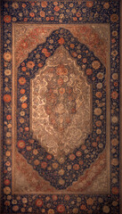 Persian carpet. Texture of old carpet. Vintage ethnic pattern
