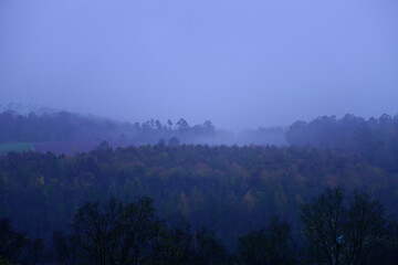 Fog outside the city on a cloudy autumn day in Bavaria.