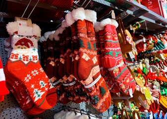 Christmas stockings socks are hanging on store shelves and are ready to be sold in the shop during a Christmas show before the start of the december holiday season