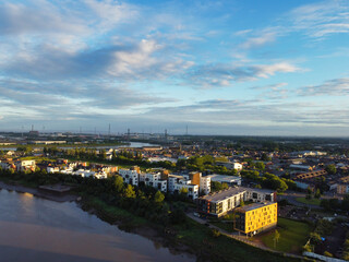 Naklejka premium High Angle View of Newport City on River Usk Wales, United Kingdom During Sunset. Aerial Footage Was Captured with Drone's Camera on May 27th, 2024