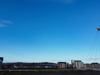 Naklejka premium High Angle View of Newport City on River Usk Wales, United Kingdom During Sunset. Aerial Footage Was Captured with Drone's Camera on May 27th, 2024