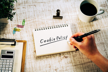 There is notebook with the word Cookie Policy. It is as an eye-catching image.