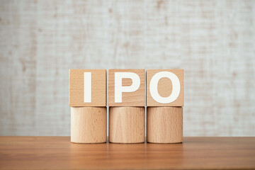 There is wood cube with the word IPO. It is an abbreviation for Initial Public Offering as eye-catching image.