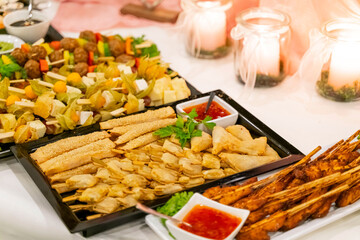 Grilled chicken with vegetables on a wedding buffet