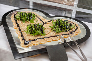 German Semmelknödel-Carpaccio (Bread dumpling carpaccio) at a wedding buffet