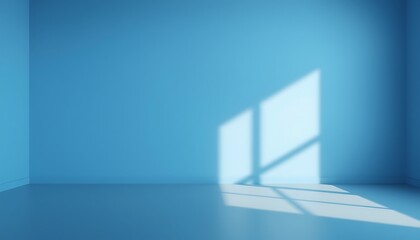 A minimalist, empty room with a single, solid blue wall that casts a warm