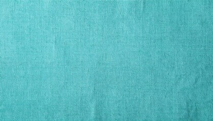 Fototapeta premium Close-up view of a teal-colored fabric texture. The woven fibers create a detailed, textured background.