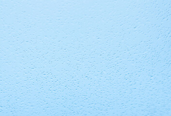 raindrops pattern formed on window when light rain started to fall. Textured background. 