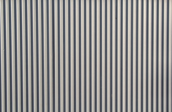 Close-up of a corrugated metal wall abstract textured background