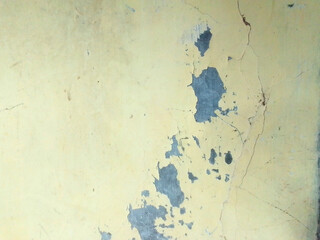 A weathered wall with deep cracks, telling stories of time and resilience. Each fracture adds character, revealing the raw beauty of imperfection