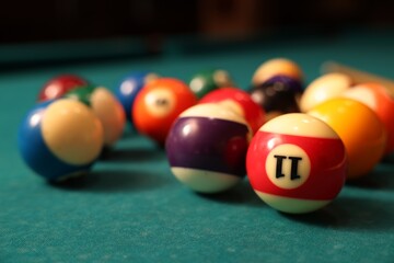 Many colorful billiard balls on green table, closeup