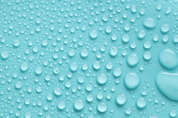 Water drops on turquoise background, above view