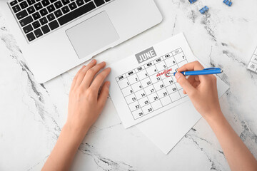 Woman with blank paper on light background