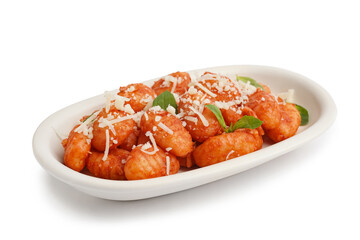 Plate of tasty gnocchi with tomato sauce and cheese on white background