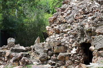 rocky formation with cave-like entrance (door)