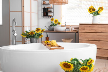 Bathroom interior full of beautiful sunflowers