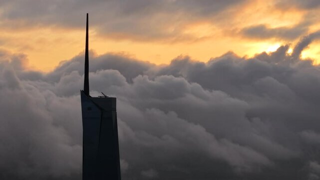 dramatic sunrise with low cloud above Kuala Lumpur city center visible sky scraper tower above the cloud