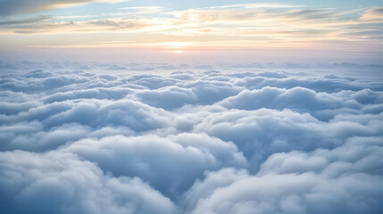 Naklejka premium A Breathtaking View of White Fluffy Clouds, Illuminated by a Golden Sunset Above, Forming a Serene and Tranquil Atmosphere in the Sky