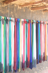 colorful clothes hanging in a shop