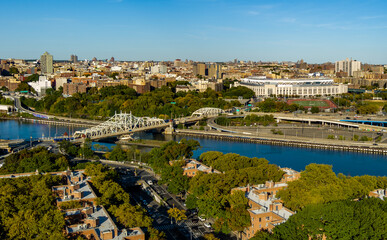 Aerial View of Yankee Stadium, Macombs Dam Bridge & the Harlem River on a sunny day.