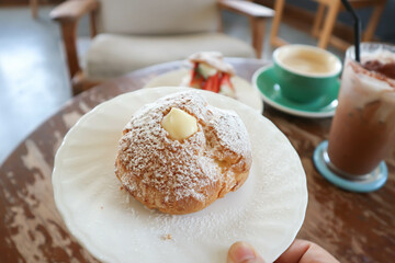 choux cream or cream puff, eclair in a small dish