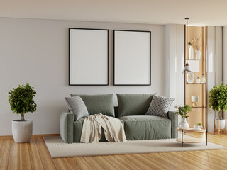 Living room with a green couch and two empty picture frames on the wall- 3D rendering