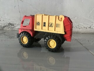 Toy Garbage Truck Isolated on White with reflek photo