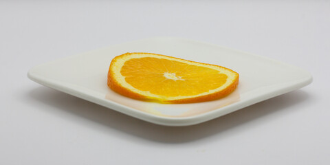 Sunkist orange slices on a white plate
