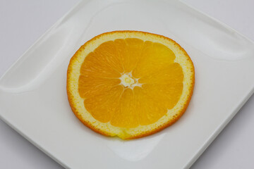 Sunkist orange slices on a white plate