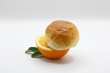 orange slices and bread on isolated background