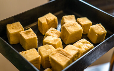 close up of fried tofu on plate